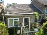 A 2 bedroom modern bungalow with a well proportioned garden to the rear. Double glazing, gas central heating and no onwa